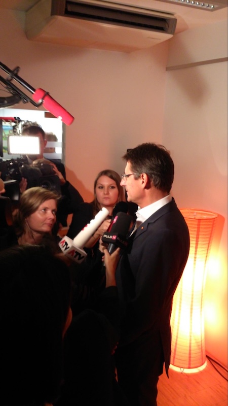 Figure 1: Then BZÖ leader Josef Bucher attempts to mask his disappointment to skeptical journalists on Election Night 2013. Photo by the Author.